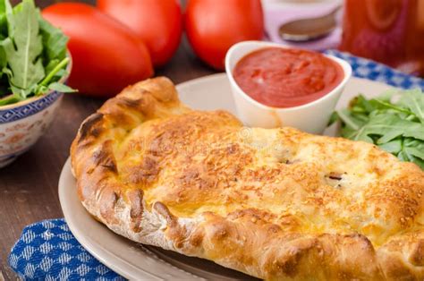 Calzone pizza stock image. Image of homemade, herb, knife - 22039231