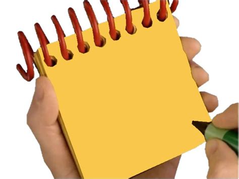 a hand holding a yellow notepad with red pins sticking out of it