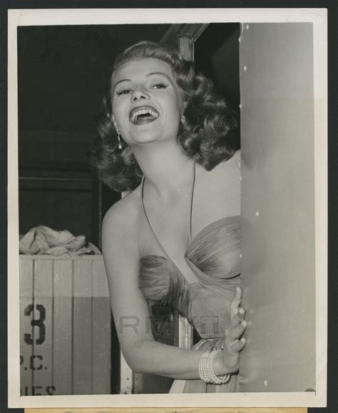 Lot # 570: 1952 Rita Hayworth, "Pin-Up Style Photo in Low Cut Dress