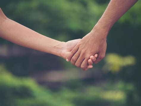 Image of a couple holding hands together 1965875 Stock Photo at Vecteezy