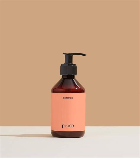 Single Prose custom shampoo bottle on tan background.