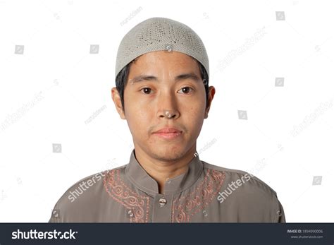 muslim man wearing kopiah hat isolated stock photo