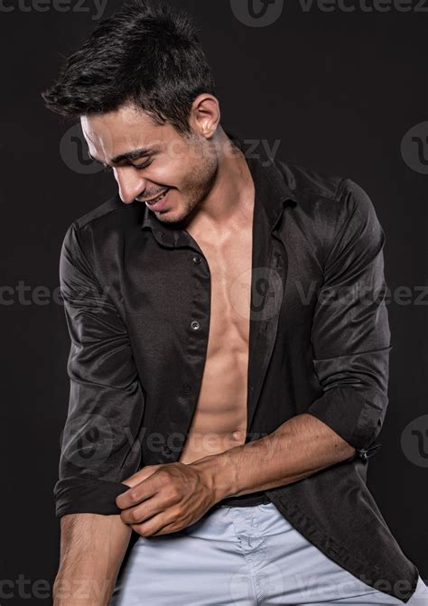 Handsome Arab male model with perfect body posing in studio. Portrait
