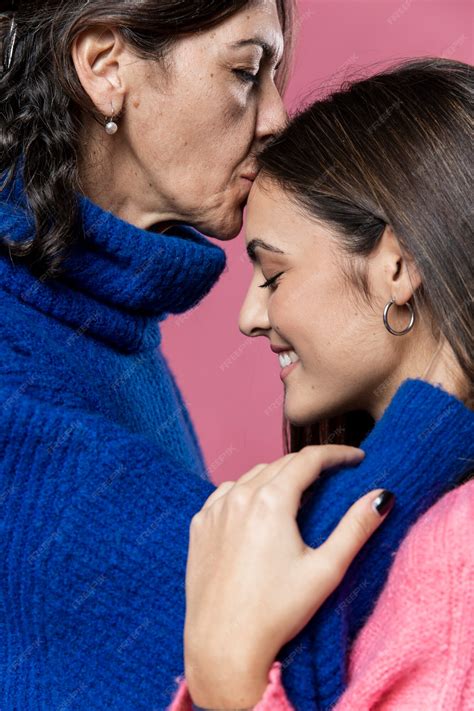 Free Photo | Close-up mom kissing daughter