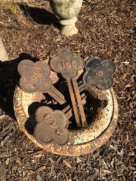 Set of Four Cast Iron Quatrefoil Numbered Grave Markers, 19th Century